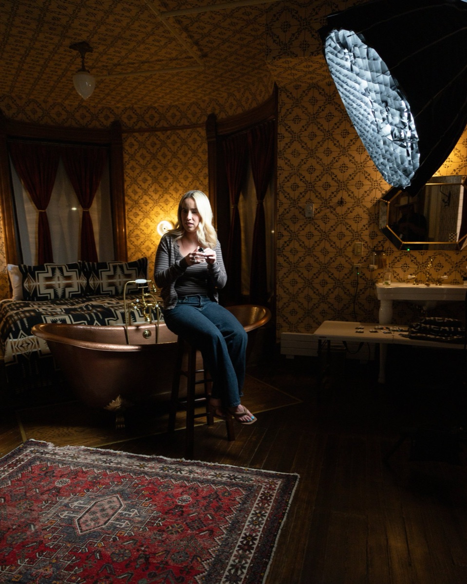 Guest lounging in the copper bathtub at Urban Cowboy during Anti-Networking Denver